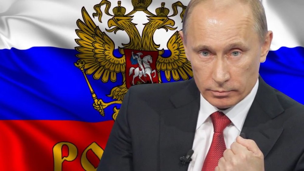 Владимир Владимирович на фоне флага
